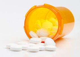 urine-testing-opioid-crisis-l-19-293-0941 Prescription Bottle Full of Pills